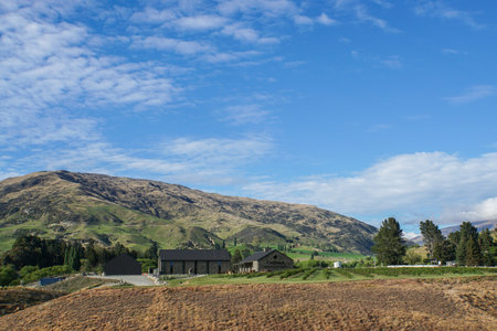 Otago / New Zealand - 28 October 2017: Cardrona Museum on green hill in sunny dayのeditorial素材