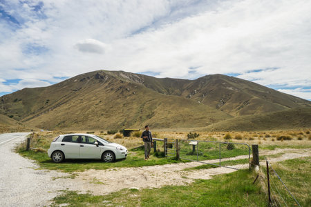 men photographer travel in Lindis pass in New Zealand by road tripのeditorial素材