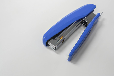 isolated top view office stationary of big blue staplerの写真素材