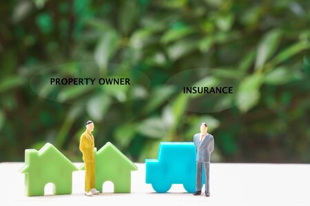 property insurance concept - icon of policy insurance underwriting and house and car ownerの写真素材