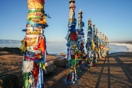 Irkutsk / Russia - February 14 2019: close up the sacred poles at Shaman rock in lake Baikal in sunset timeのeditorial素材