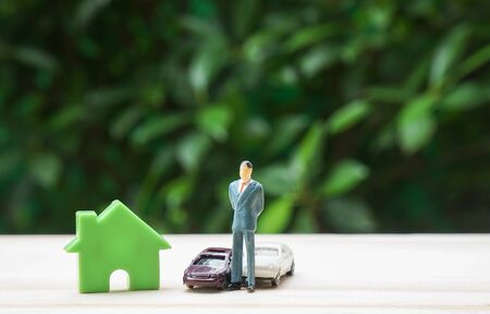 prosperity concept of successful businessman with house and luxury carsの写真素材