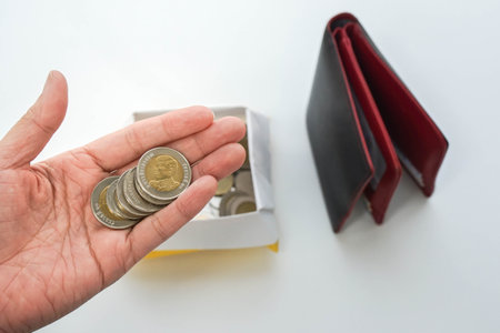 Bangkok / Thailand - May 16 2019: economical concept - people save Thai Baht money for the prosperity in future and life planningのeditorial素材