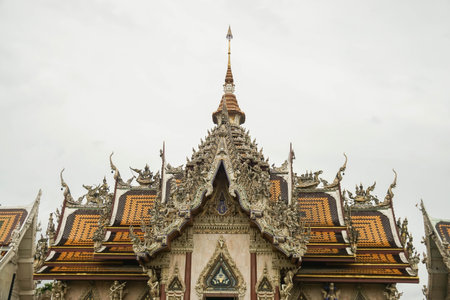 Nakhonpathom / Thailand - July 3 2019: Close up beautiful Srisathong temple roof for Buddhist respect and make meritのeditorial素材