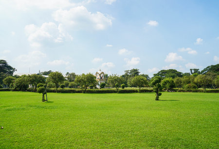 Nakornpathom / Thailand - May 09 2019: wide green yard with Ganesha shrine in sunny day at Sanam Chandra palaceのeditorial素材