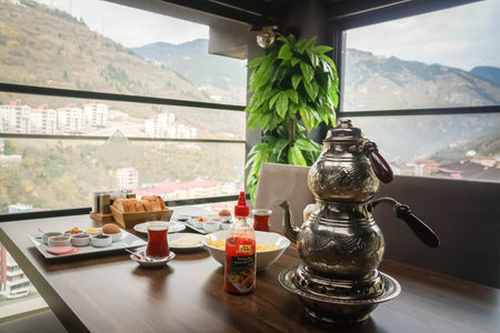 Trabzon / Turkey - traditional breakfast Turkey with Turkish tea pot on wooden table in hotelのeditorial素材