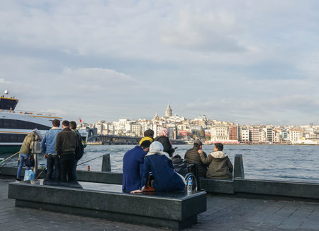 Istanbul / Turkey - December 12 2019: group of people sit in the seaside at Bosphorus Cruise Tours in holidaysのeditorial素材
