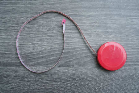 flat lay cute measuring tape for woman shape