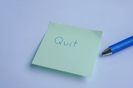 flat lay business concept to quit the job with handwriting on sticky note with penの写真素材