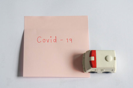 health concept of covid-19 treatment with flat lay ambulance hospital van for first aidの写真素材