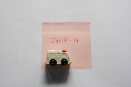 health concept of covid-19 treatment with ambulance hospital vanの写真素材