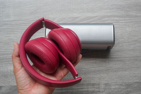 close up woman hold wireless headphone in hand for music in workout activitiesの写真素材