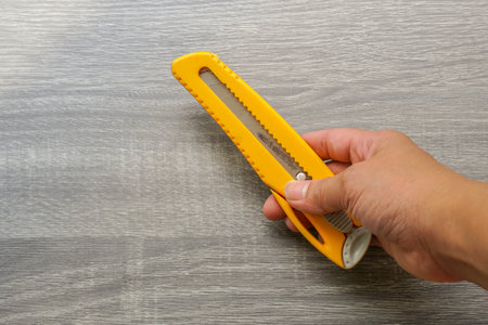 close up people use yellow cutter in for cutting