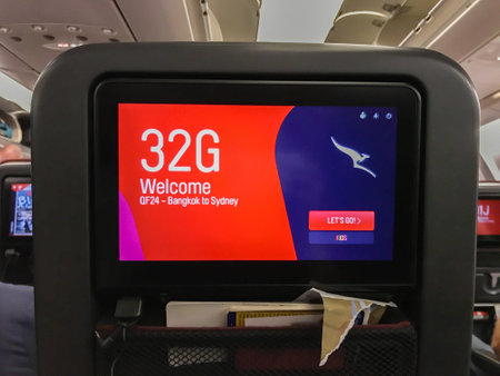 Bangkok / Thailand - December 10 2019: passenger screen on seat with welcome on board messageのeditorial素材