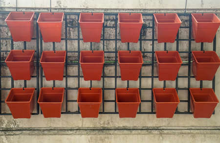 empty square flower pot in vertical garden at house wall for plantingの写真素材