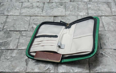 travel bubble concept - put passport book in travel case for holidaysの写真素材
