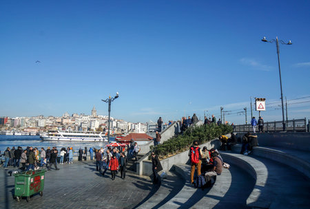 Istanbul / Turkey - December 11 2019: people at New Mosque square along the sea in sunny dayのeditorial素材