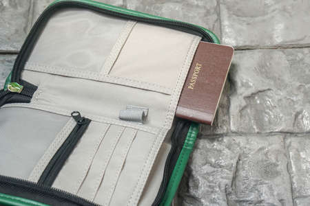 travel bubble concept to prevent Covid-19 - put passport book in travel case for holidaysの写真素材