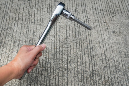 close up service engineer hold wrench for fixing and repairの写真素材