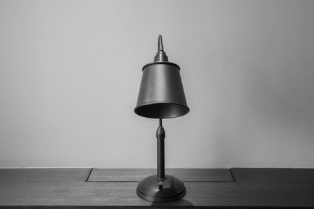 selective focus black and white vintage desk light lamp bulb for lighting in bedroomの写真素材