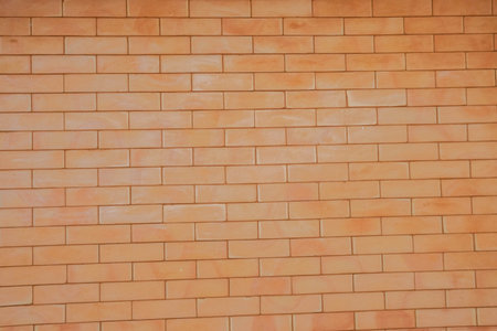 Selective focus mock up vintage orange brick wall background for wordsの写真素材