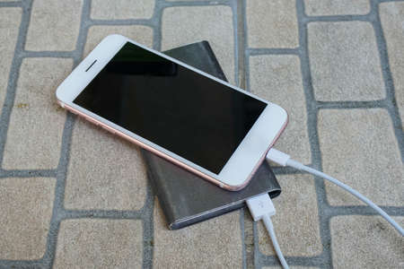 top view smartphone charge battery from power bankの写真素材