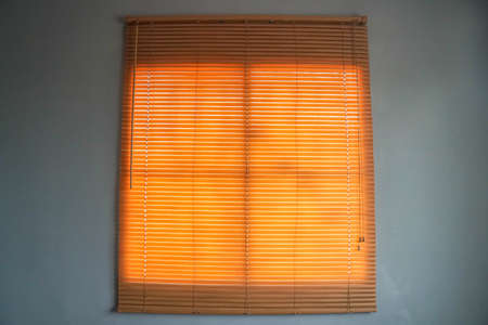 vintage bamboo blind at window in bedroom for shadingの写真素材