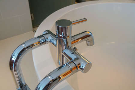 close up bathtub faucet for cold and hot water in the bathroomの写真素材