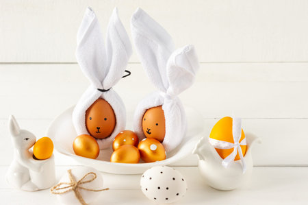 Easter Bunny ears made from napkins and eggs. Festive decoration for holiday.