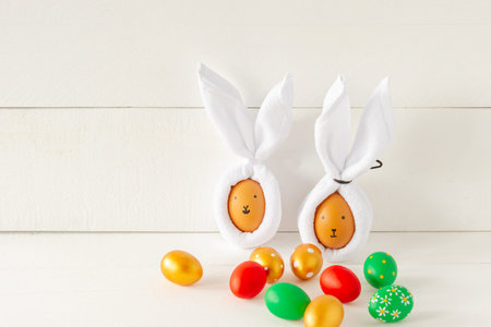 Easter Bunny ears made from napkins and eggs. Festive decoration for holiday.
