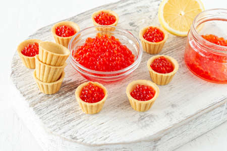 Tartlets with butter and red caviar. Gourmet food, appetizer. Delicatessen. Seafoodの写真素材