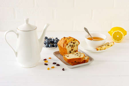 Homemade freshly baked cake loaf with raisins. Traditional treat for tea or coffee. Pound cake. Delicious breakfastの写真素材