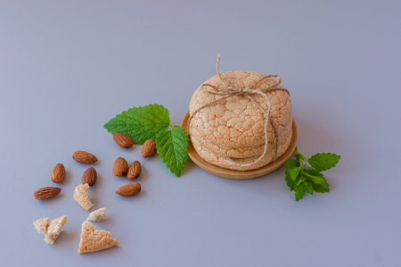 Homemade Almond cookies with nuts and mint on a gray background