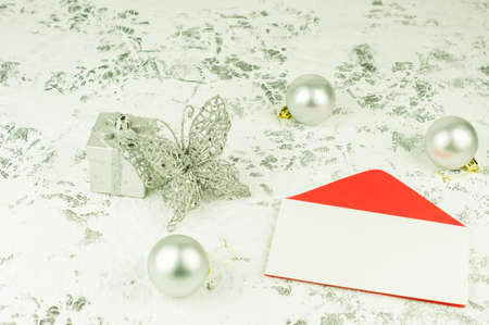 layout of an empty envelope for your text on a New Year's festive background with silver balls, a box and an openwork butterflyの写真素材