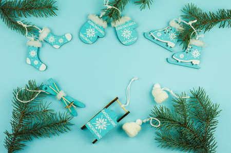 New Year's Christmas blue background with spruce branches and decorative wooden and knitted toys.view from above. a copy of the spaceの写真素材