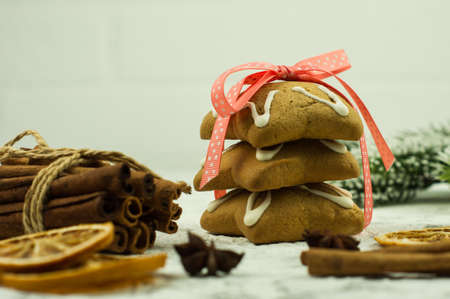 Christmas gingerbread cookies and spices on wooden background. Assortment of festive food.の写真素材