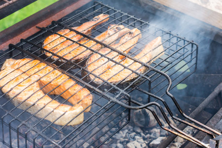 fresh salmon fish steaks on the grill. the concept of cooking on the street, backyard