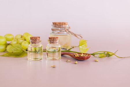 a set of different glass bottles with cork cap with natural organic grape seed oil. elixir of youth....