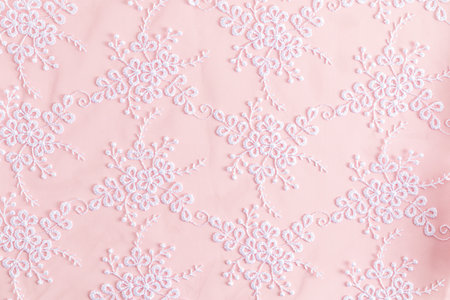 Lace background with colors. abstract lace. floral decoration. white embroidery on delicate pink...