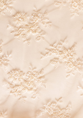 Luxurious beige or champagne color lace background. embroidery with flowers with bisser. vertical wedding background.の写真素材