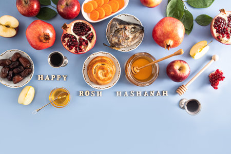 Beautiful background for the new Jewish New Year. traditional products on a blue background with wooden letters Rosh Hashanah. Top view.の写真素材