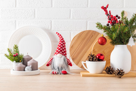 Cozy, comfortable interior design, decorated for the holiday of the New Year. Kitchen countertop with New Year's dishes, decorations, candlesの写真素材
