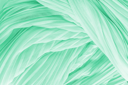 Delicate air waves of mint, green colored silk or chiffon fabric. Layout for design. Background...