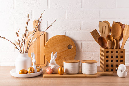 Eco-friendly kitchen utensils, wooden cutting boards, vase with willow twigs, Easter decorations....
