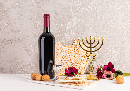 Beautiful festive still life for the Jewish Passover holiday. Front view of traditional foods,...