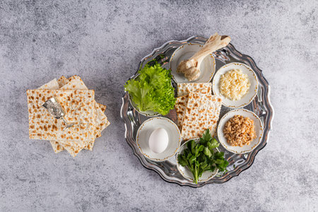 Top view of a silver rich seder tray with traditional treats for the Jewish Passover holiday. Marble background. Passover conceptの写真素材