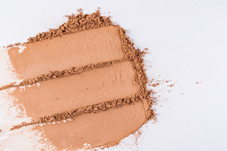 Chic cosmetic texture of loose dry powder in a brown tone. Abstract beautiful lines of powder texture. layout, design. A copy space. close upの写真素材