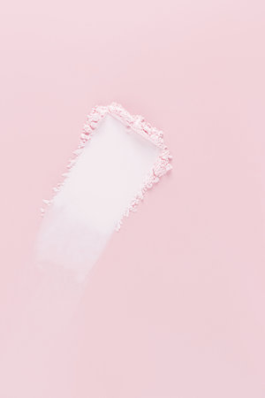 A beautiful swatch of natural loose powder for cosmetic facial skin care. pink vertical background. A copy space. Blank layout. mockup. . textureの写真素材