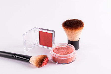 Two packs of different blush, professional brushes on a white background. concept of beauty,...