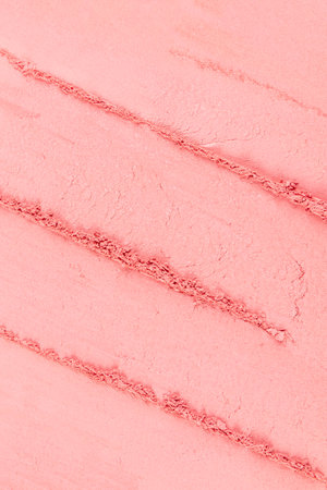 Three chic samples of pink blush. texture background. parallel strokes of loose dry blush. top view. A copy space. texture of cosmetics. close upの写真素材